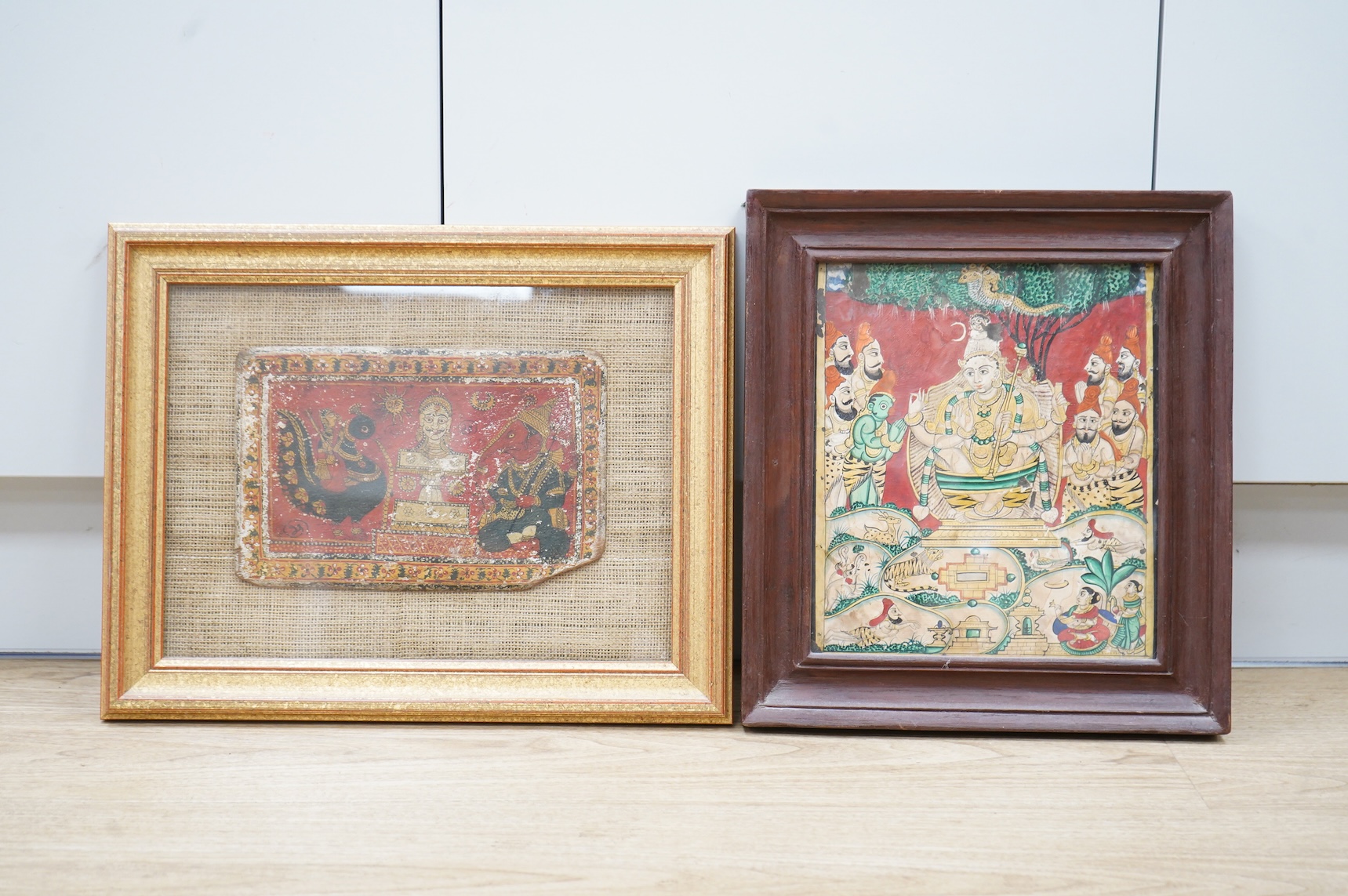 Rajasthan, 19th century, Stylised oil on wood panel, together with a similar example of a deity, watercolour on paper, largest 27 x 24cm